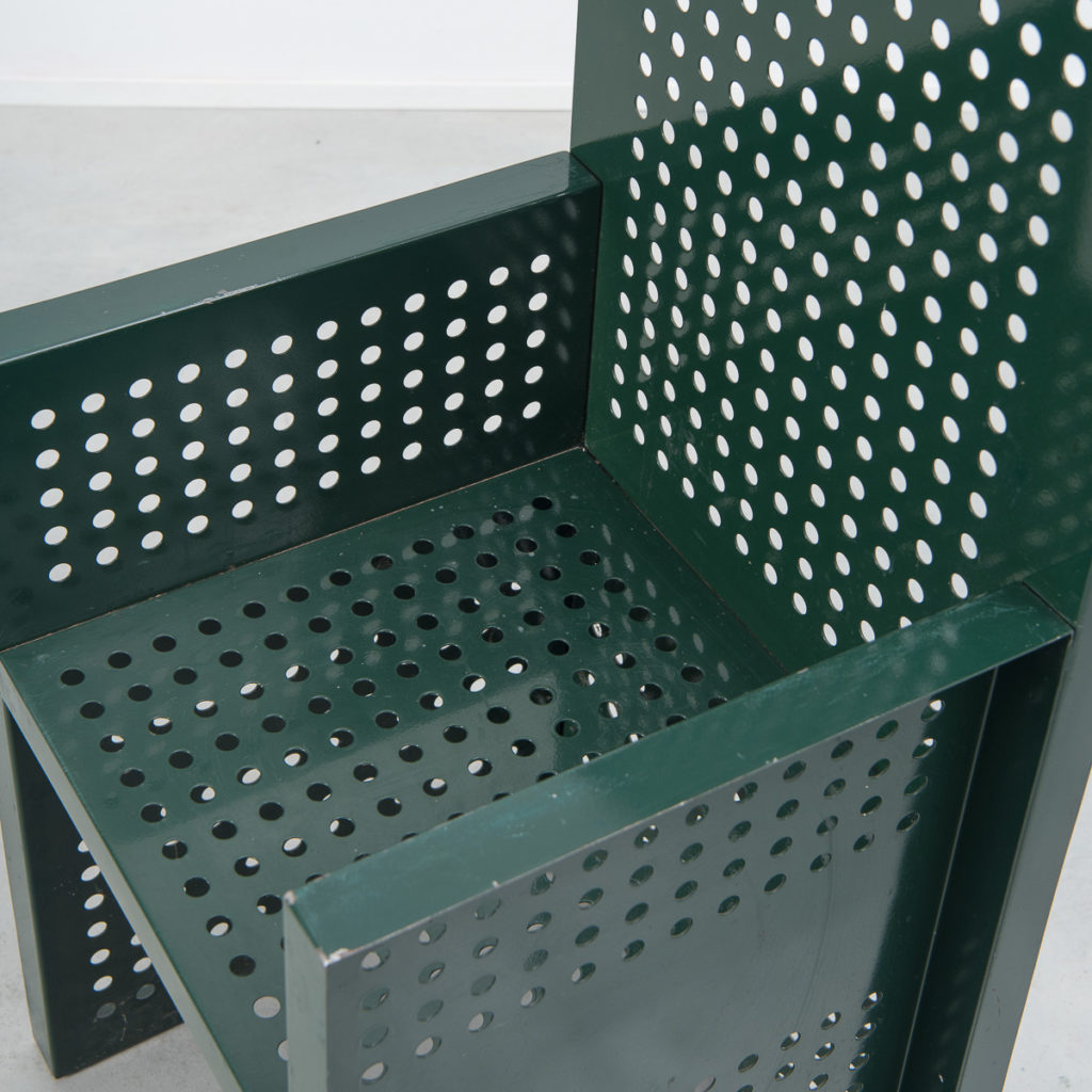 Green perforated metal chairs