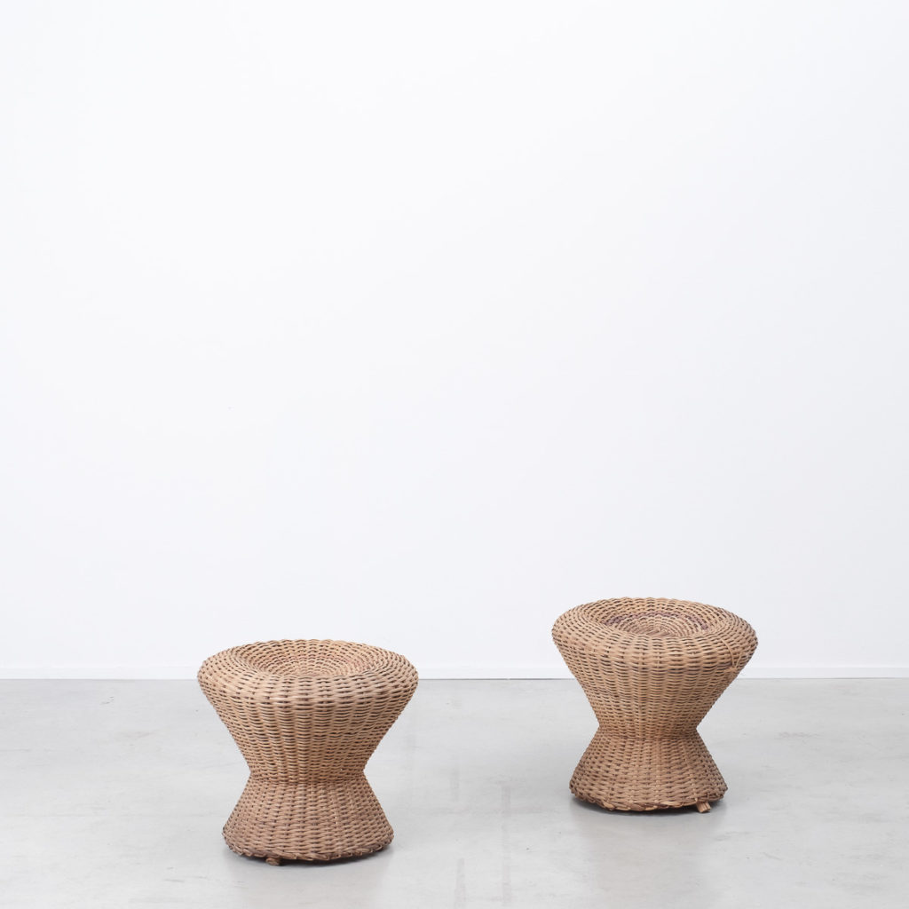 A pair of rustic rattan stools