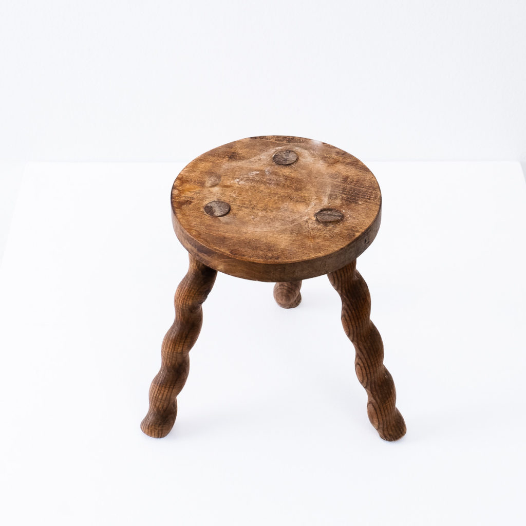 Wavy wooden legged stool