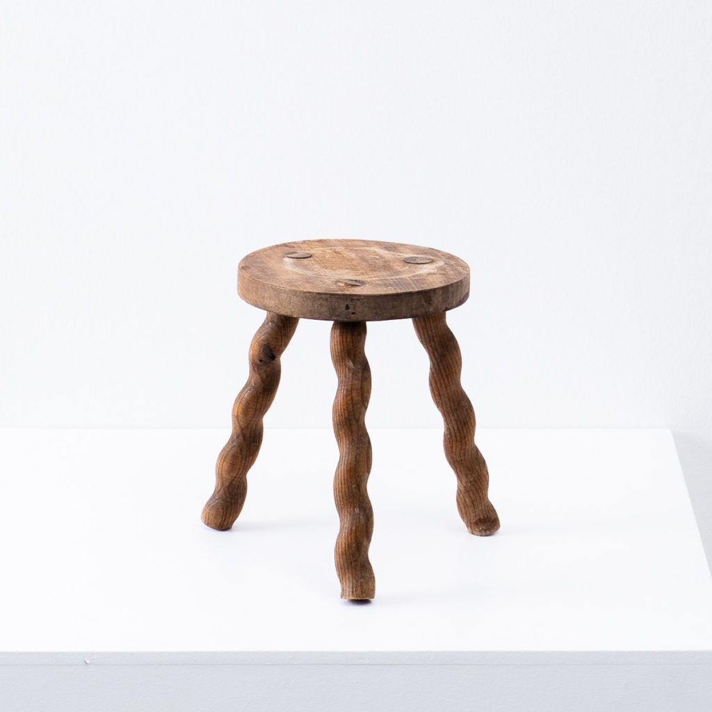 Wavy wooden legged stool