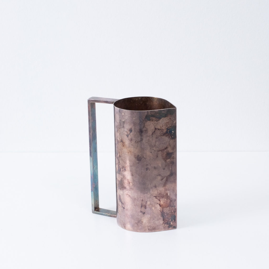 Patinated silver pitcher