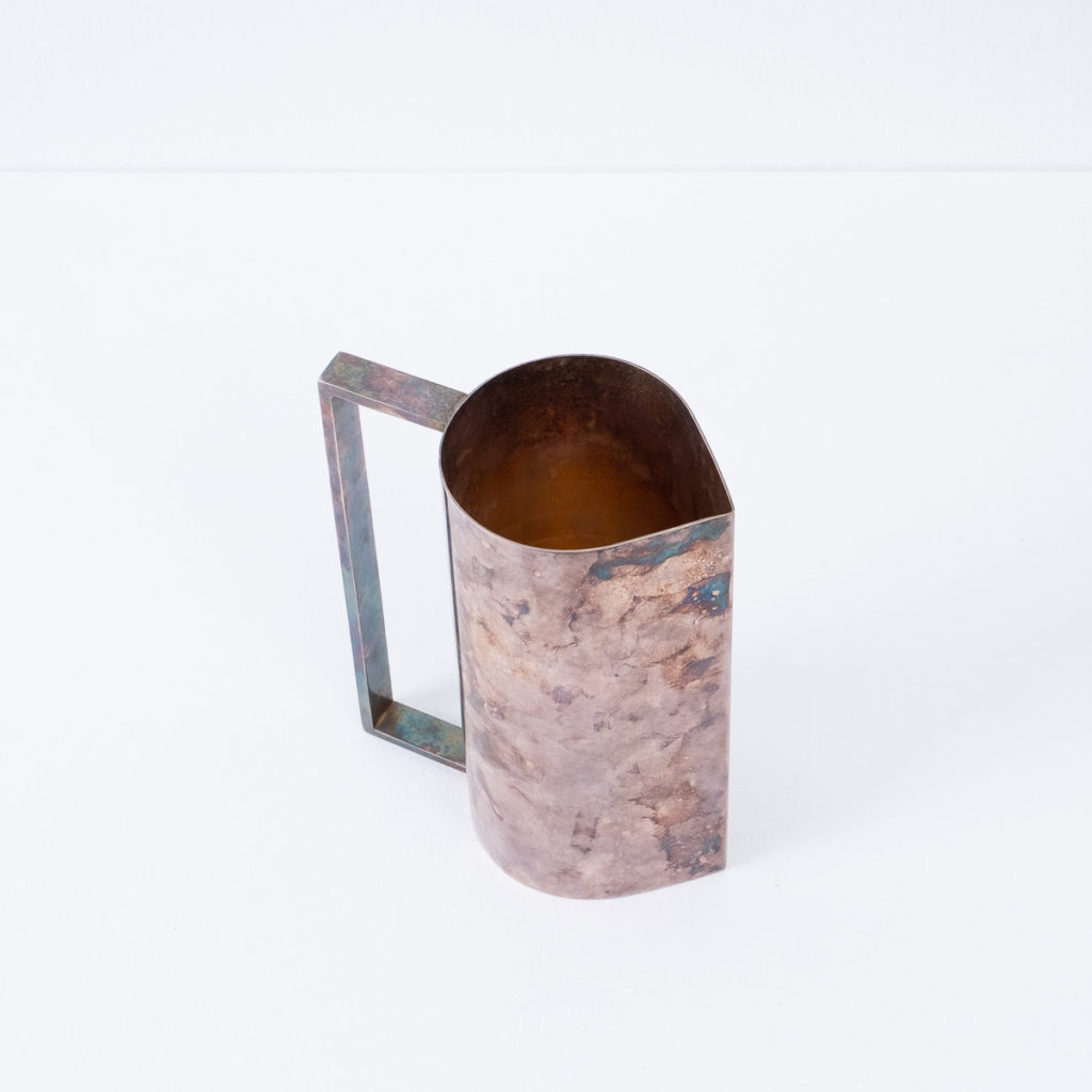 Patinated silver pitcher