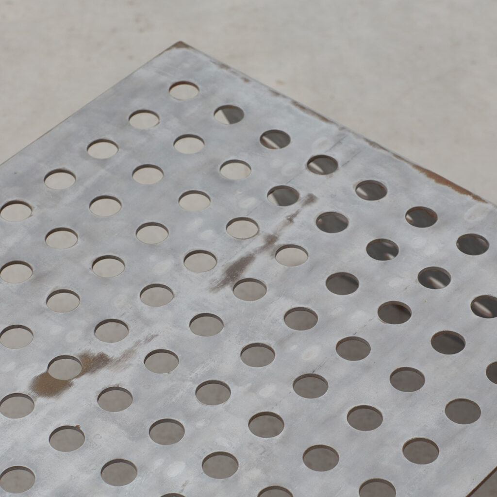 Perforated aluminium metal table