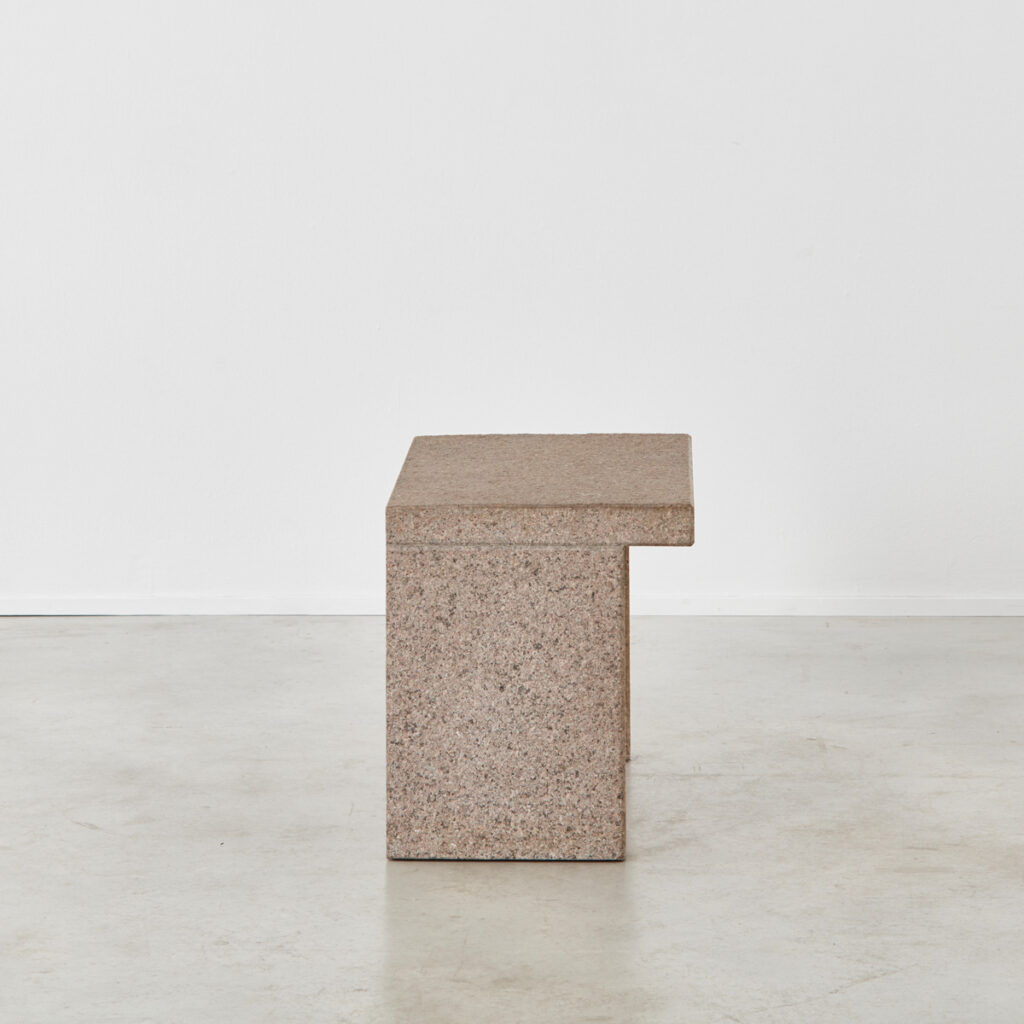 Two minimalist stone side tables