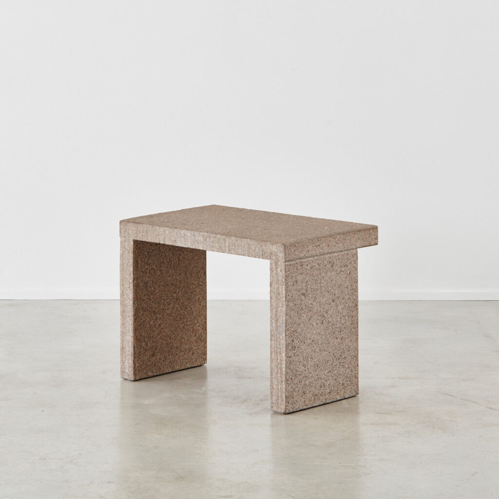 Two minimalist stone side tables