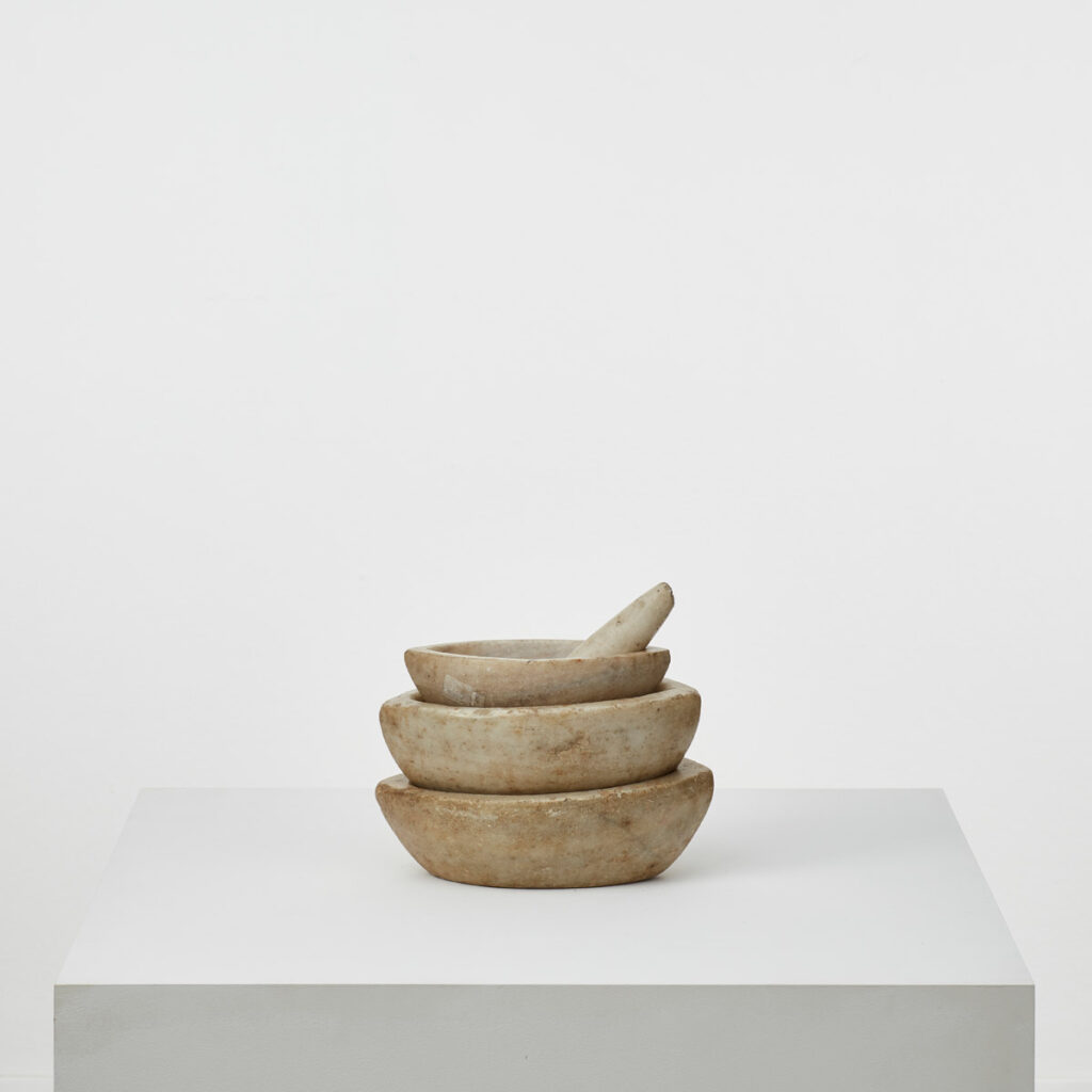 A nest of marble mortars & pestle