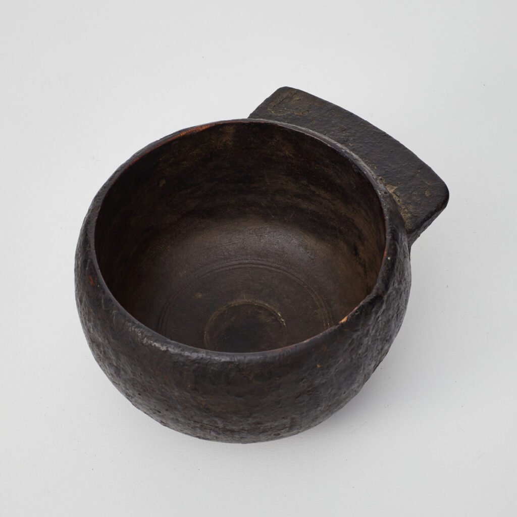 Antique tarred wooden pot