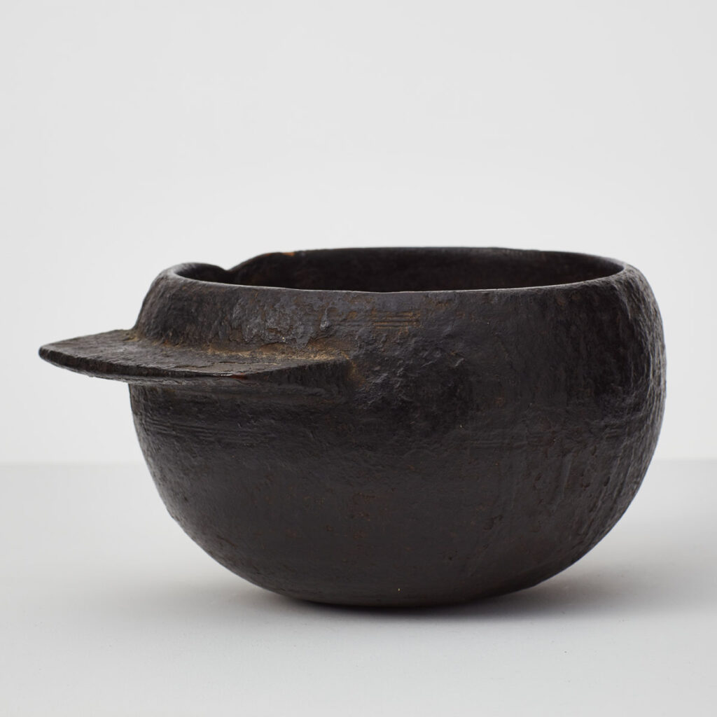 Antique tarred wooden pot