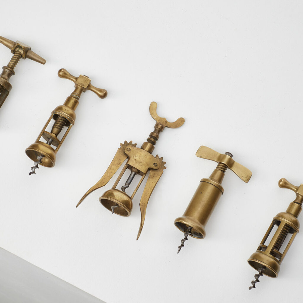 Antique brass corkscrews