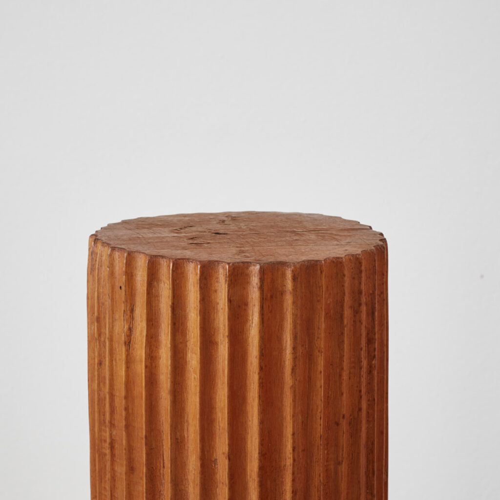 Scalloped wooden plinth