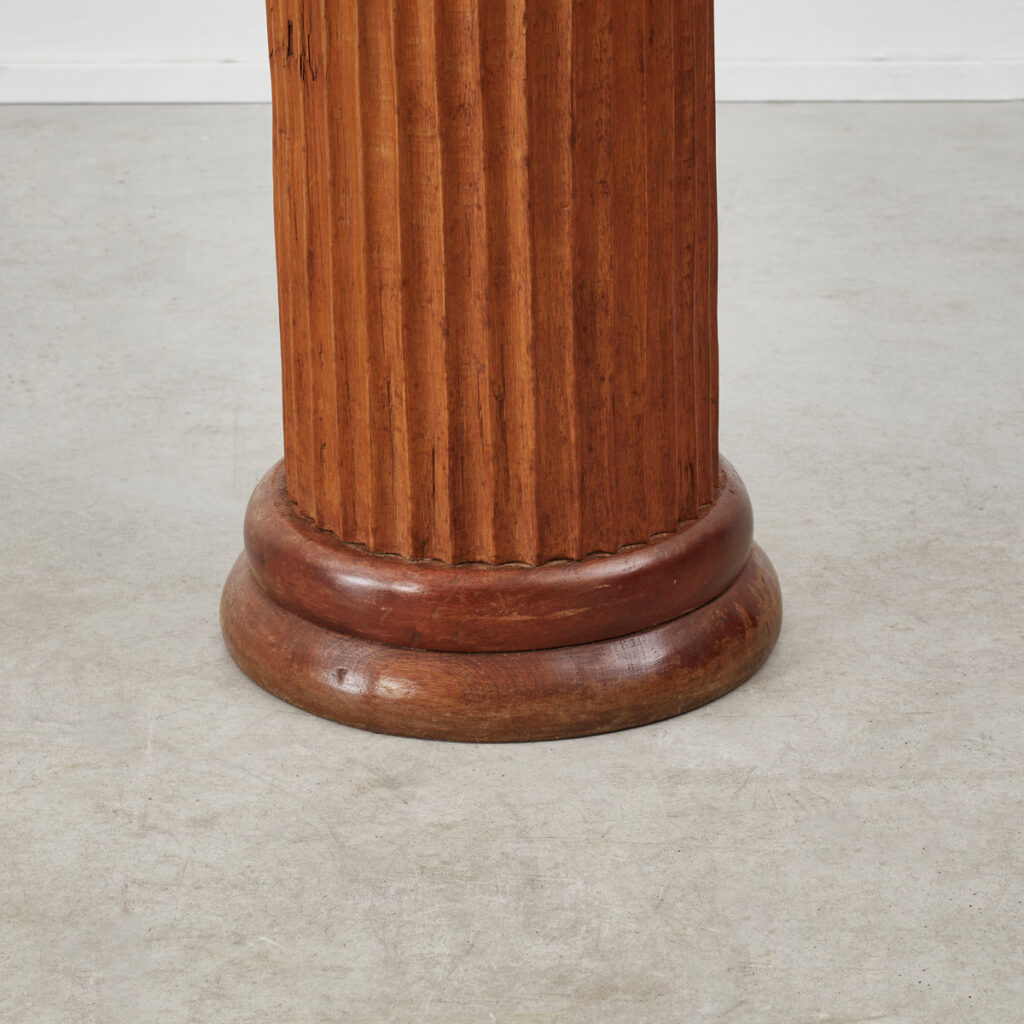 Scalloped wooden plinth
