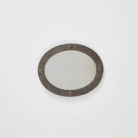 Arts & Crafts oval mirror in hammered pewter