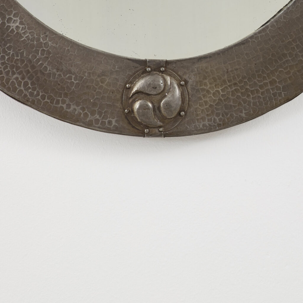 Arts & Crafts oval mirror in hammered pewter